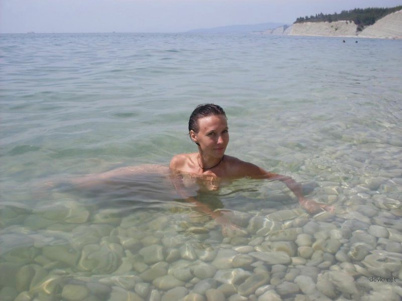 Amateur Nudist on Rocky Beach: Explicit Nude Photo Shoot