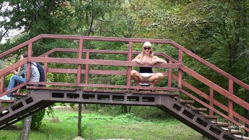 Public Pissing: Woman Peeing on Road - Amateur Porn Pic