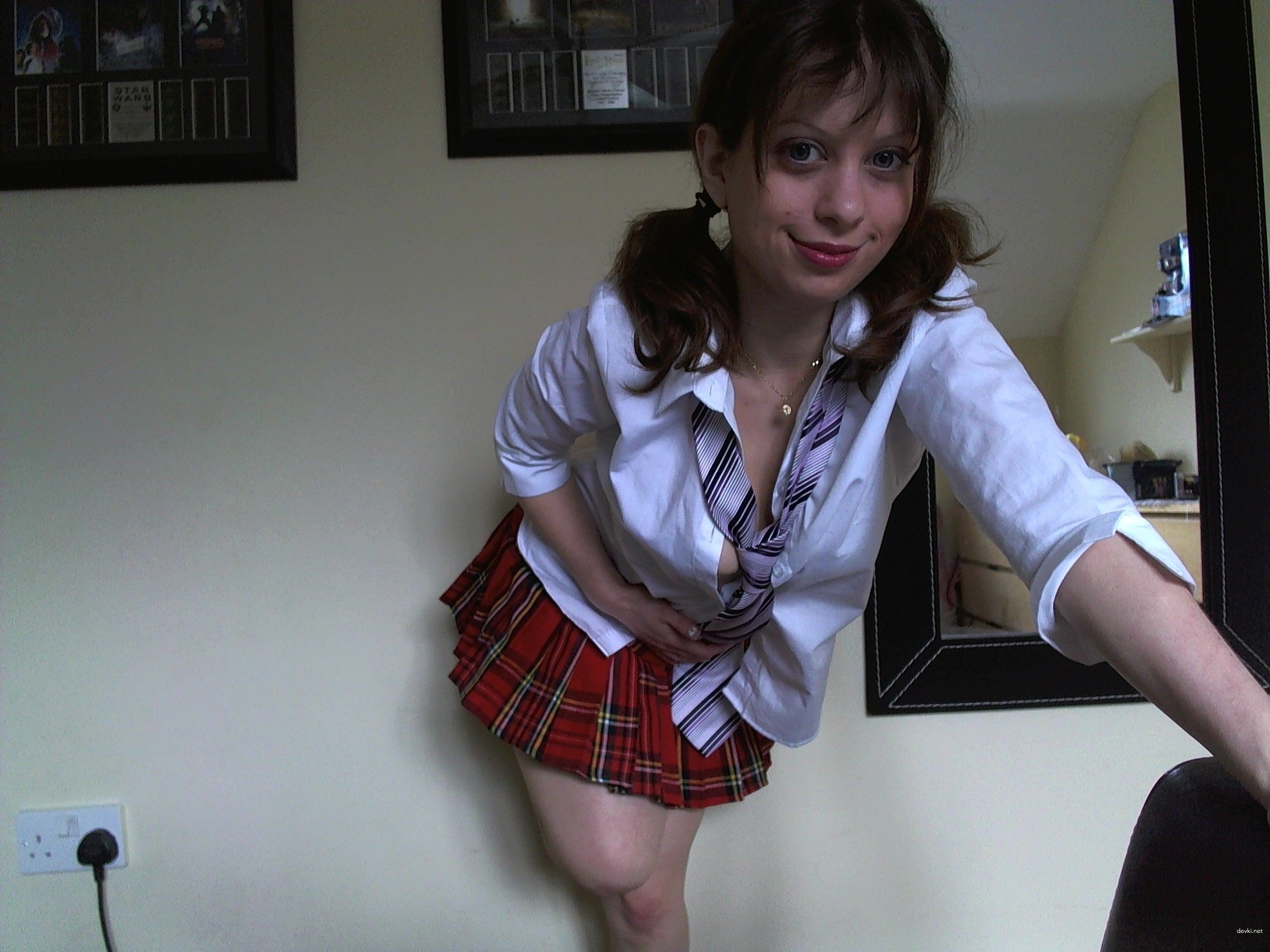 Amateur Girl Takes Explicit Photos with Various Hairstyles for XXX Fun