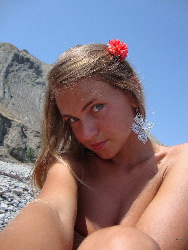Topless Girl Sunbathes and Swims Naked in the Sea: Amateur Beach Nudity