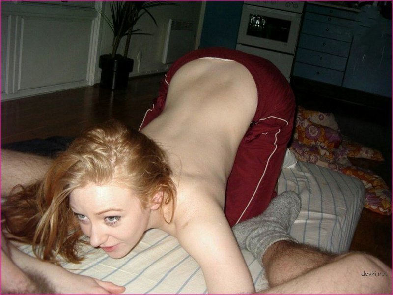 Fiery redhead babe deepthroats cock: Explicit amateur porn photo.