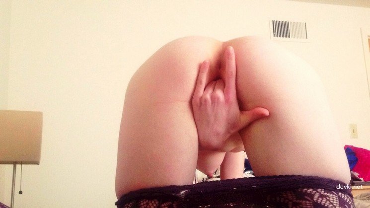 Fiery Redhead Trying on Red Dress in Amateur Porn Pic