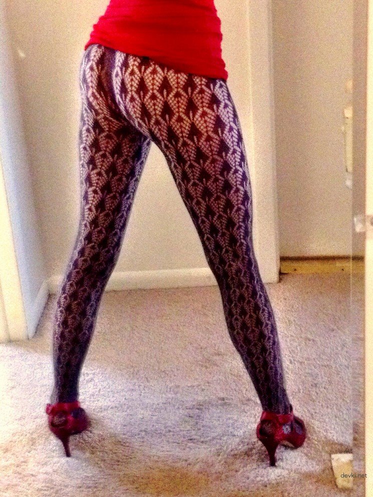 Fiery Redhead Trying on Red Dress in Amateur Porn Pic