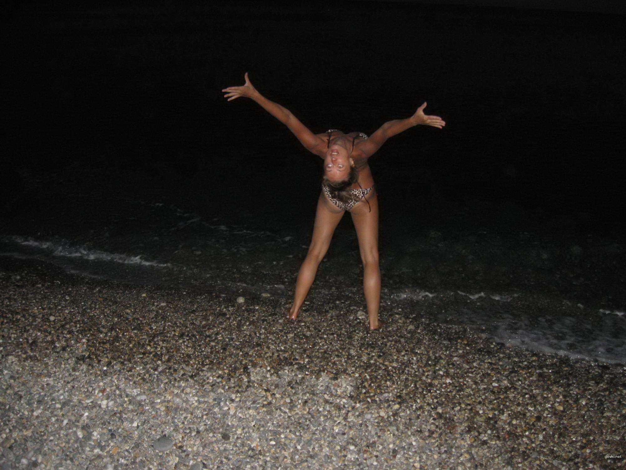 Topless Woman Poses Boldly on Vacation Beach