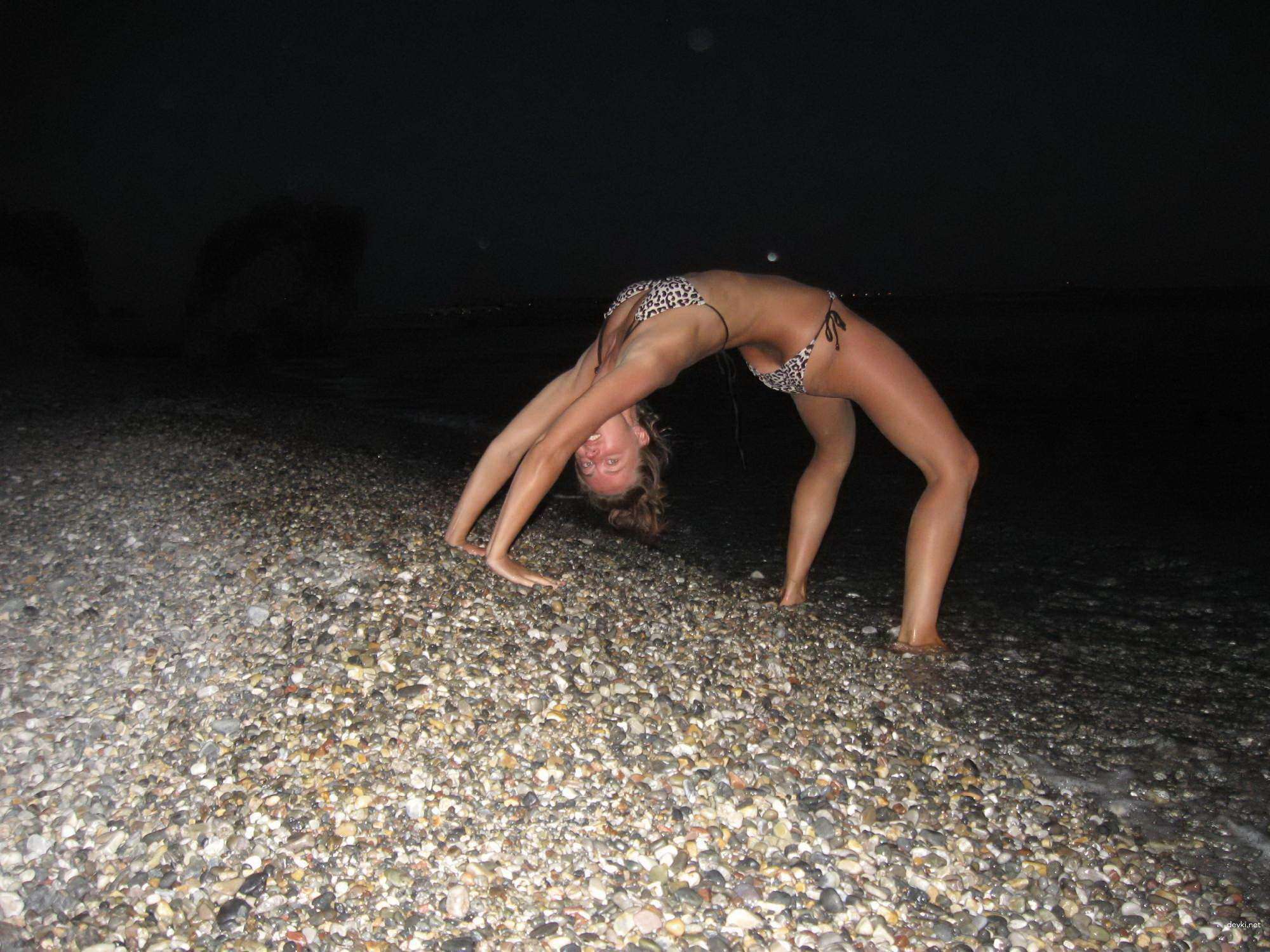 Topless Woman Poses Boldly on Vacation Beach