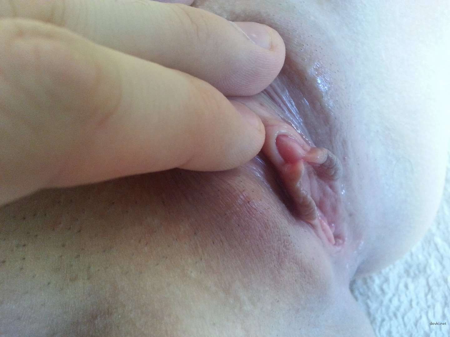 Amateur Girl Exposes Her Wet Pussy in Explicit Porn Photo