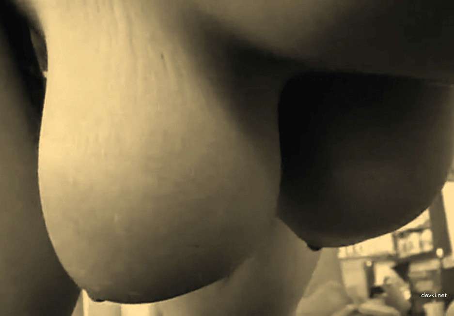 Big-titted beauty fucks her trainer in amateur porn photo shoot