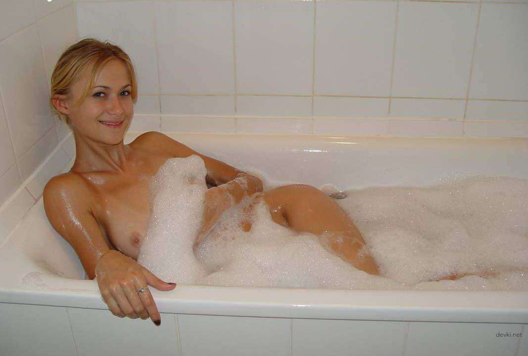 Skinny girl washing in bathtub - Explicit amateur bath time nudity