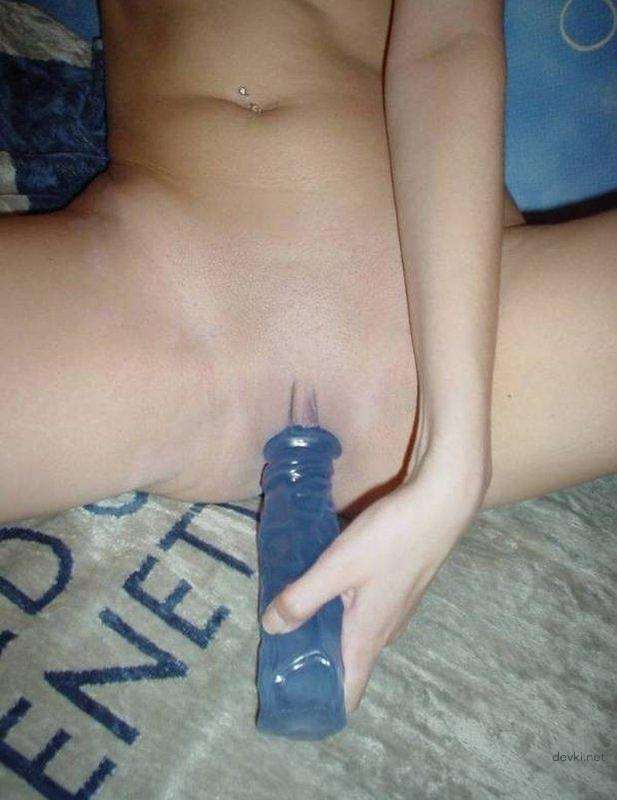 Blonde babe uses sex toy for pleasure in amateur porn pic