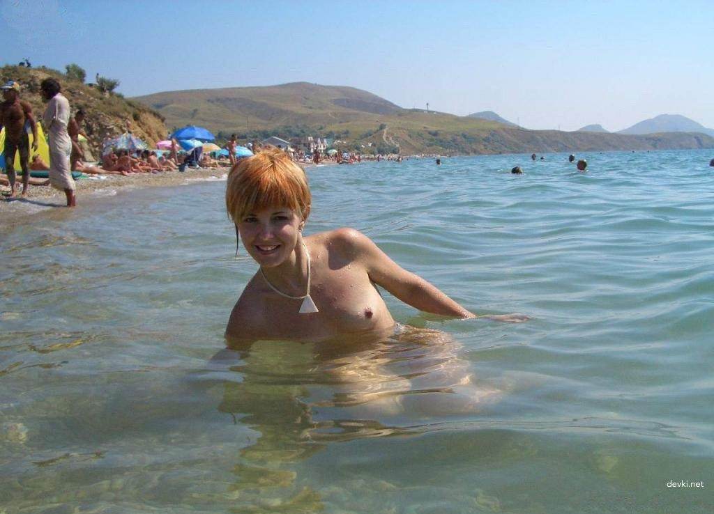 Fiery Nude Redhead Relaxing on Beach - Explicit Amateur Nudist Photo