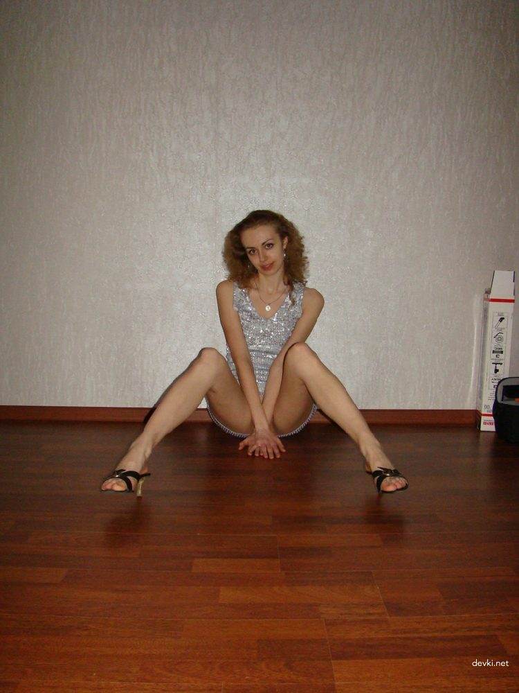 Slender Curly-Haired Amateur's Explicit Porn Photos