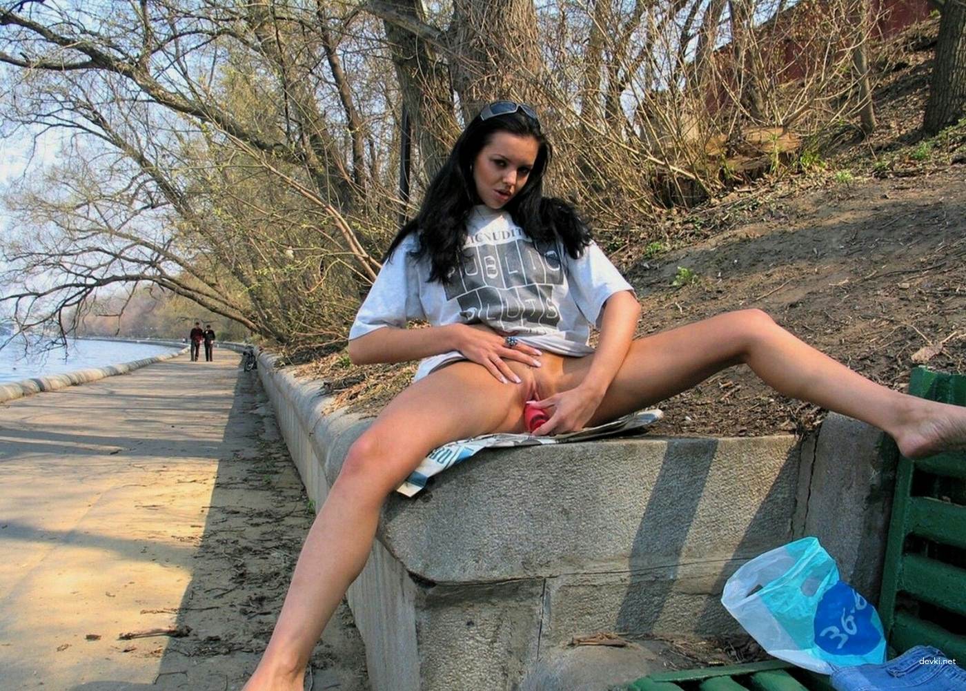 Naughty amateur fucks herself in the park - Explicit solo porn photo