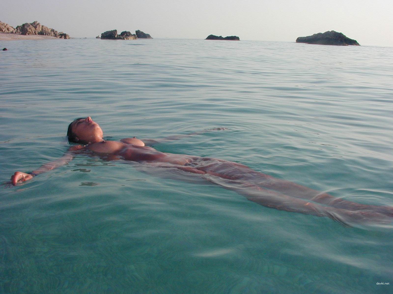 Naked Brunette at the Beach: Explicit Amateur Nude Photo