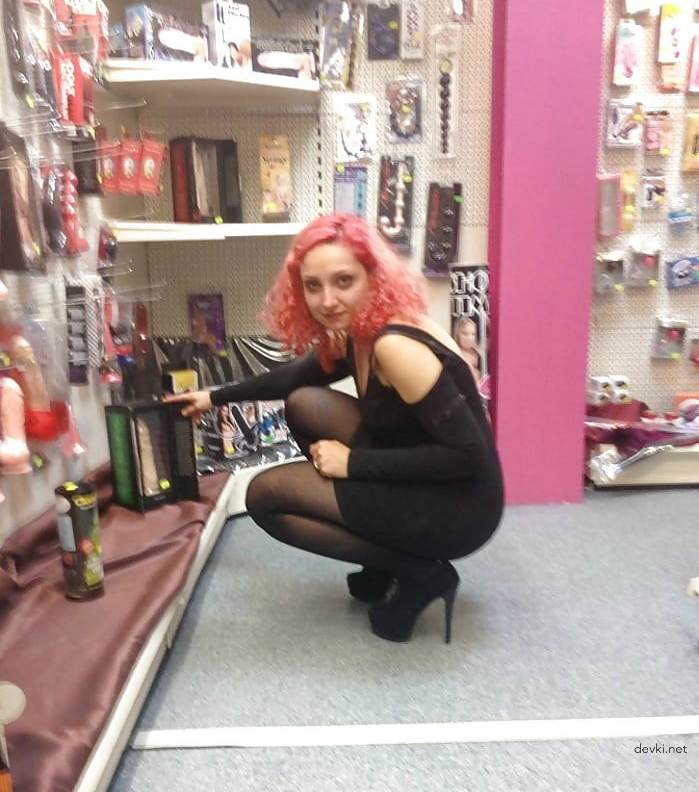 Uninhibited Seller of Intimate Goods Poses in Store - Amateur Explicit Photo