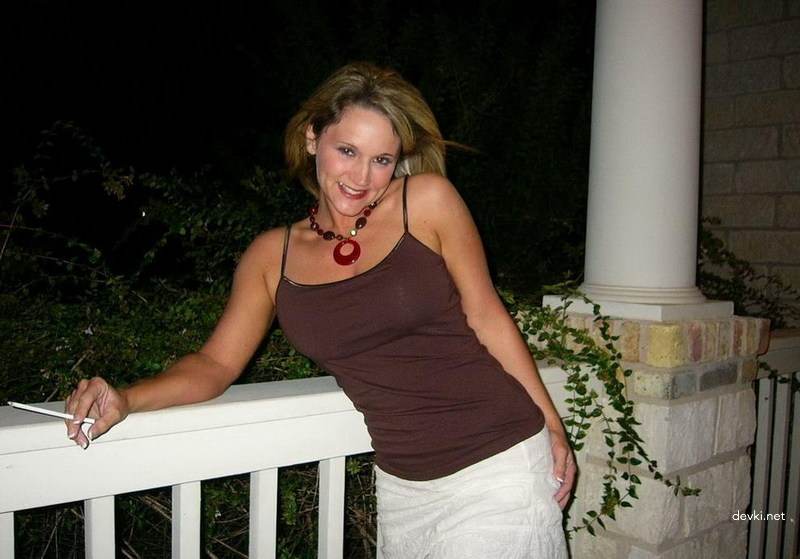 Mature Lady Exposes Her Assets on Balcony - Amateur Explicit Photo