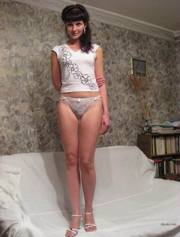 Long-legged mature woman with hairy pussy: Explicit amateur photo