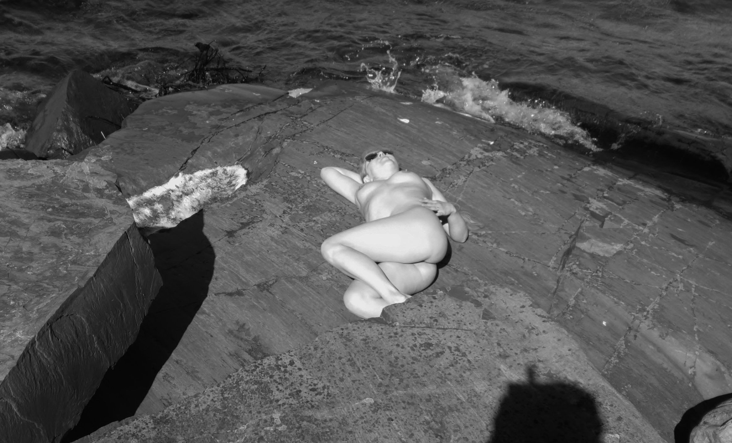 Sexy Back Pose on Rock: Amateur Photo with Explicit Content