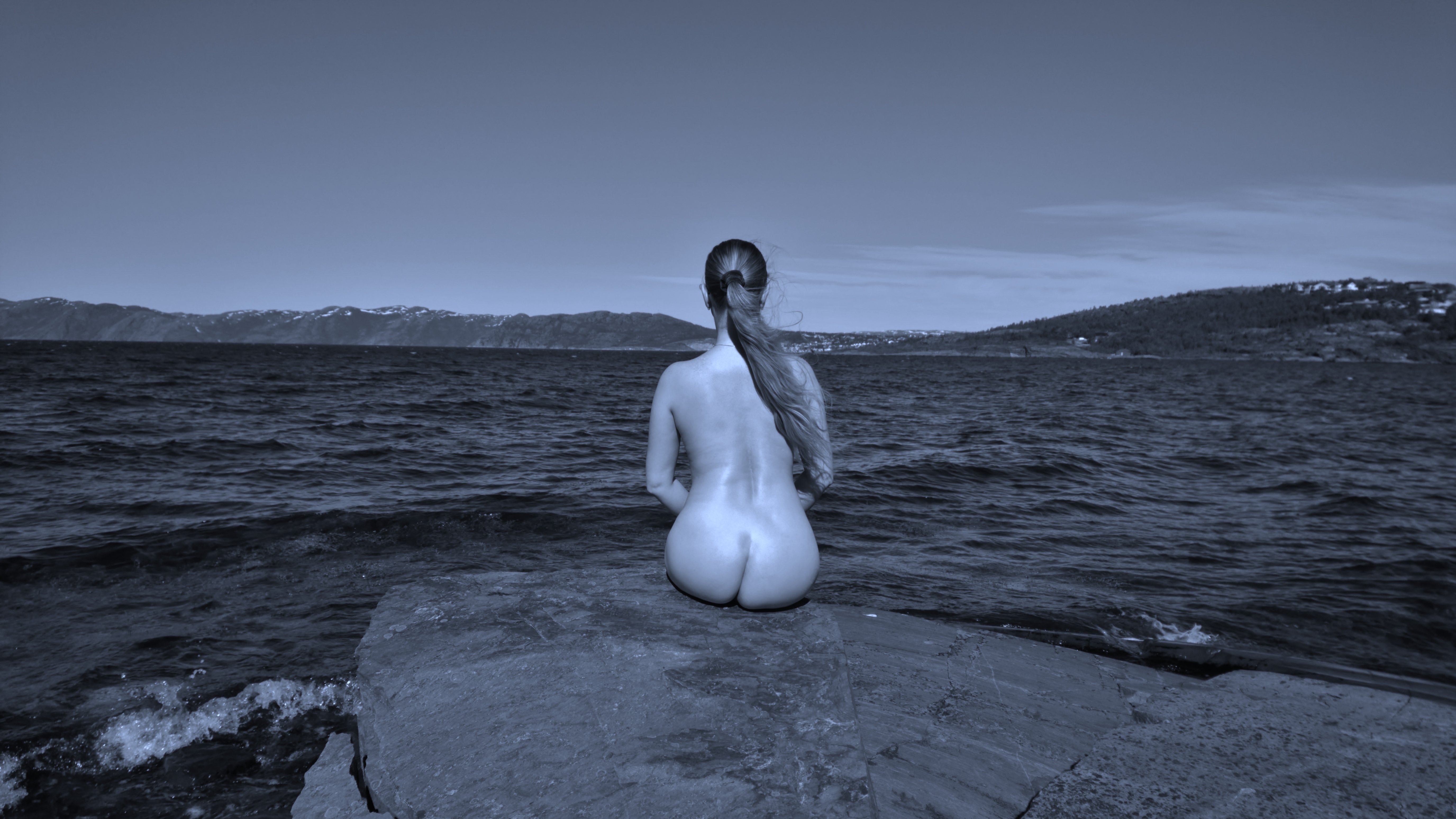 Sexy Back Pose on Rock: Amateur Photo with Explicit Content