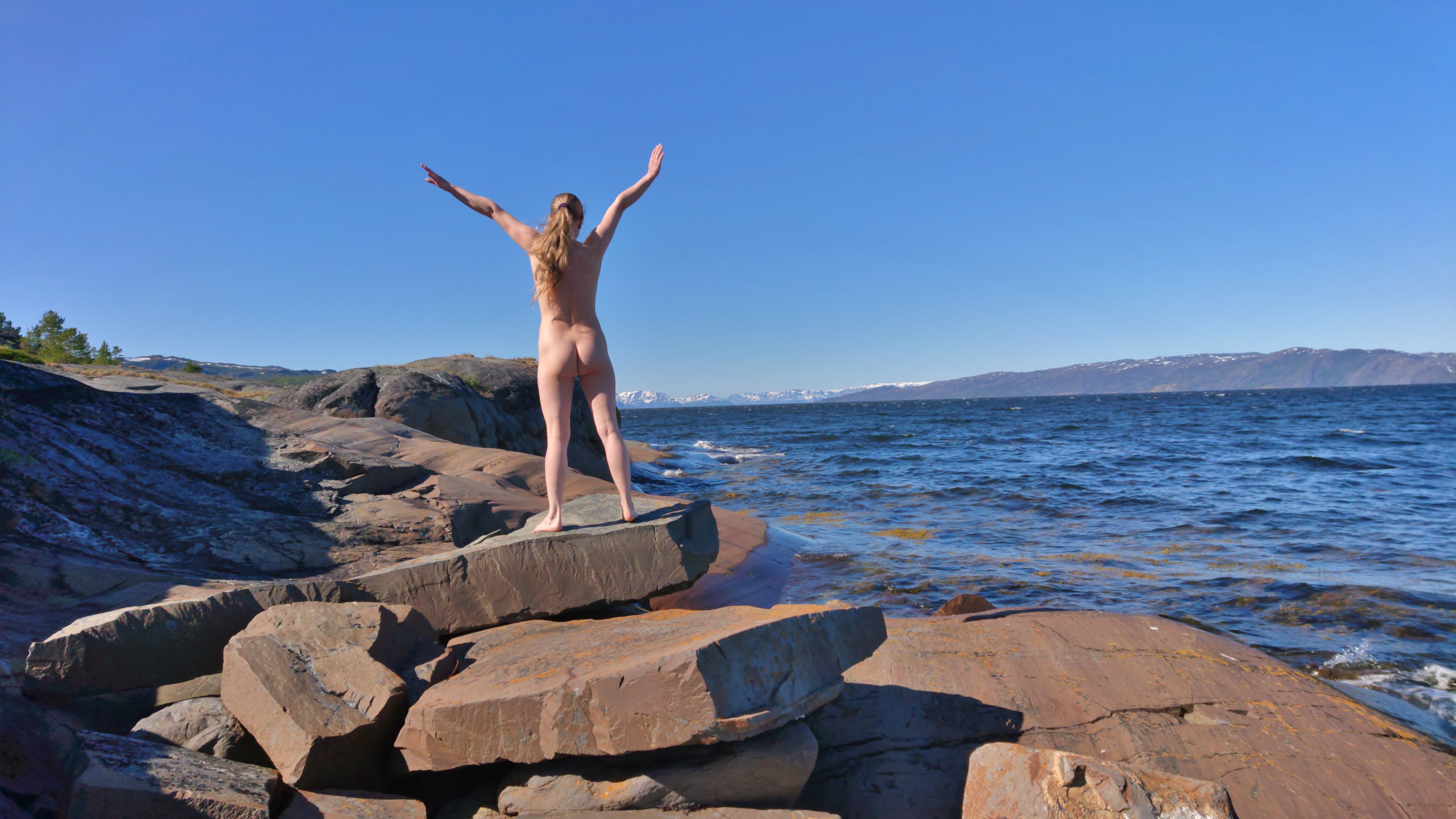 Sexy Back Pose on Rock: Amateur Photo with Explicit Content