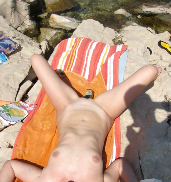 Beach Nudist Masturbates with Bottle - Explicit Amateur Porn Photo