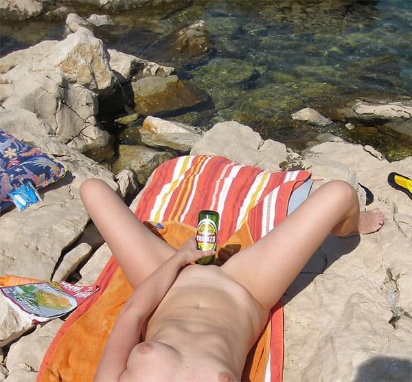 Beach Nudist Masturbates with Bottle - Explicit Amateur Porn Photo