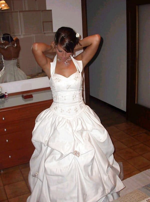 Bride posing in amateur porn photo shoot with explicit content