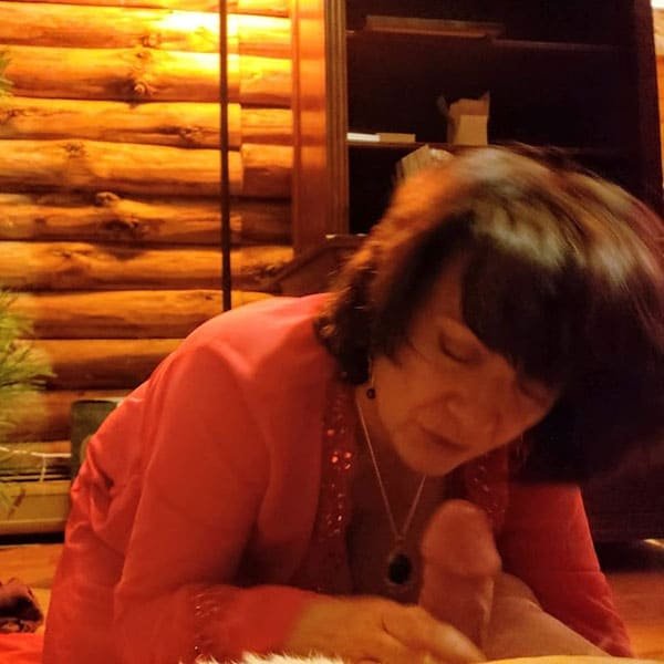 Mature MILF's New Year Blowjob: Explicit Amateur Porn Photo