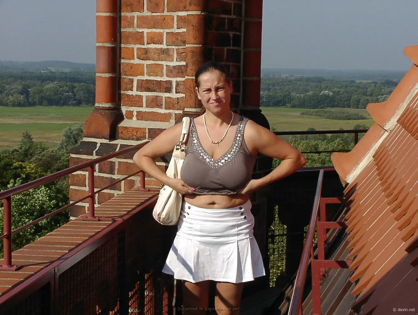 Smiling amateur posing with cock: Explicit homemade porn pic