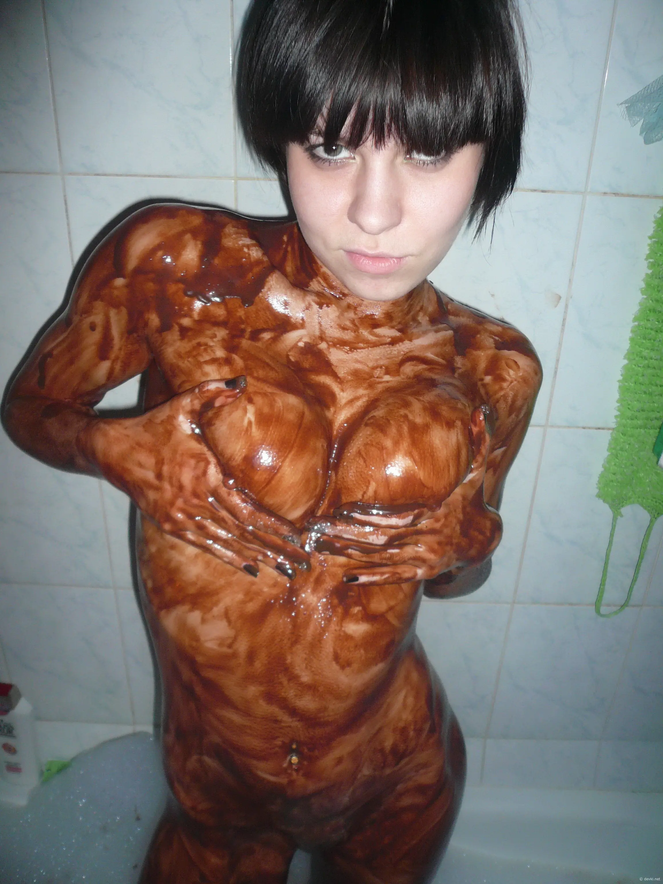 Chocolate-covered babe gives blowjob in amateur porn pic