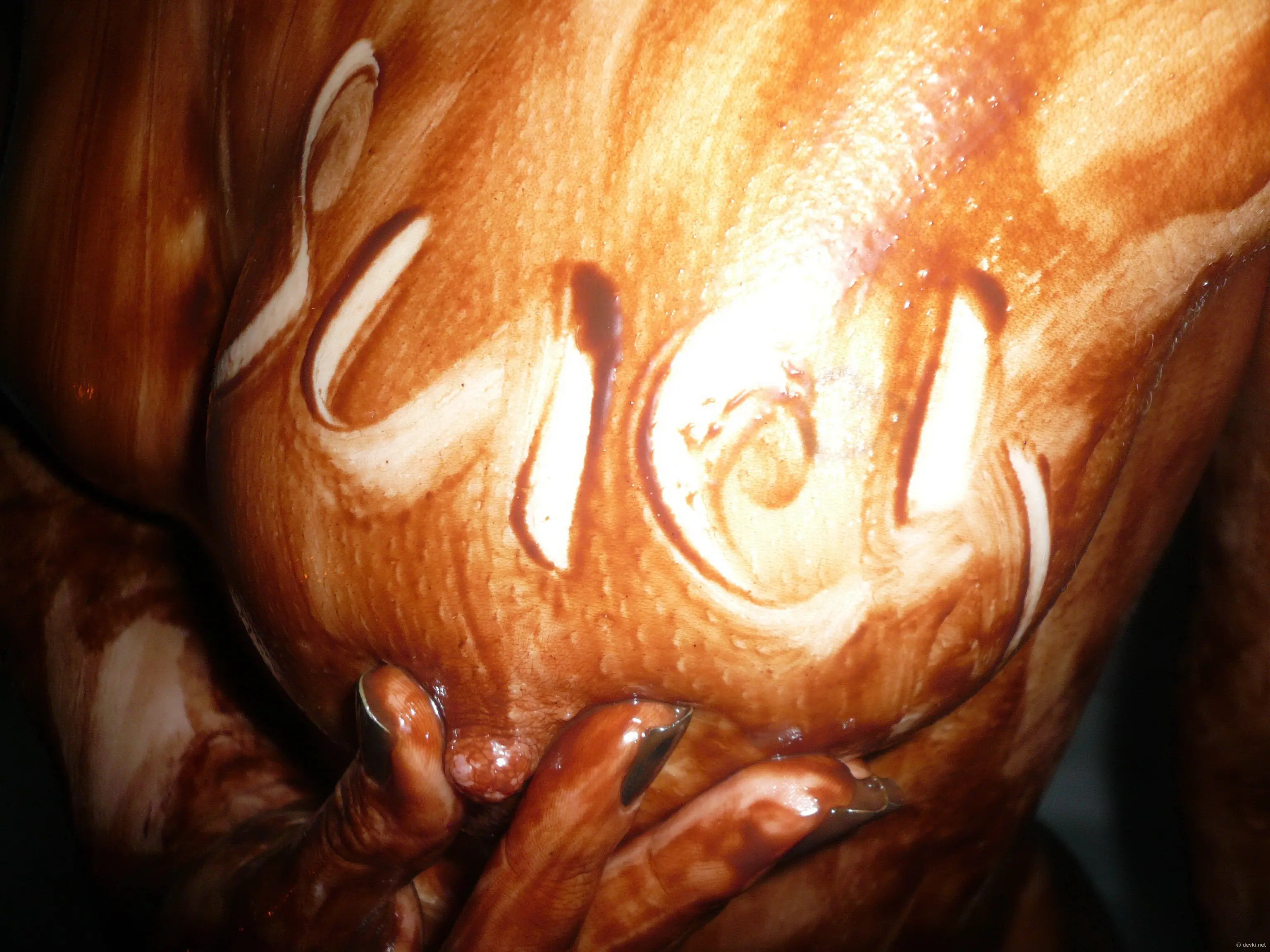 Chocolate-covered babe gives blowjob in amateur porn pic