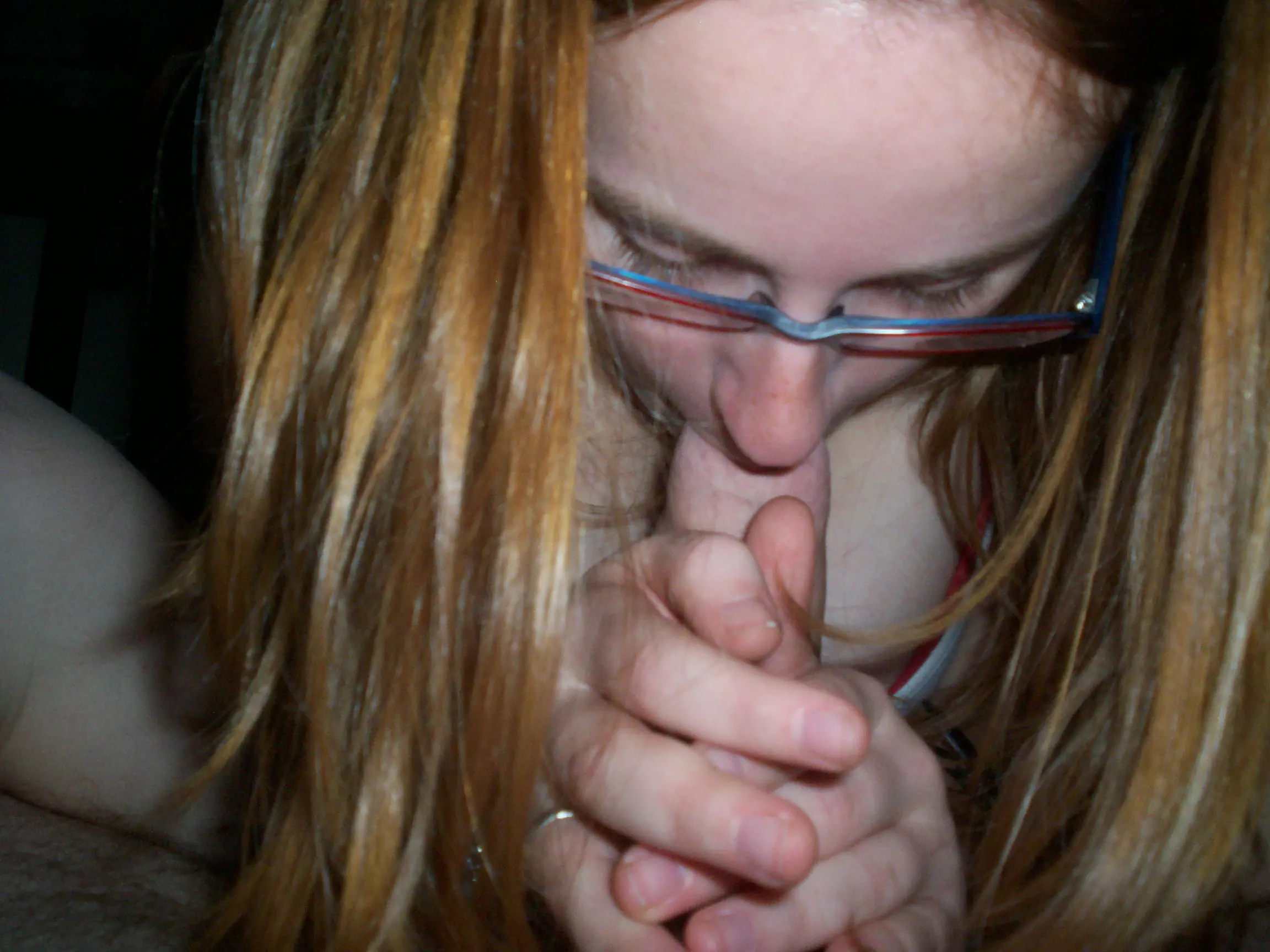 Redhead babe sucks cock and shows hairy pussy in amateur porn pic