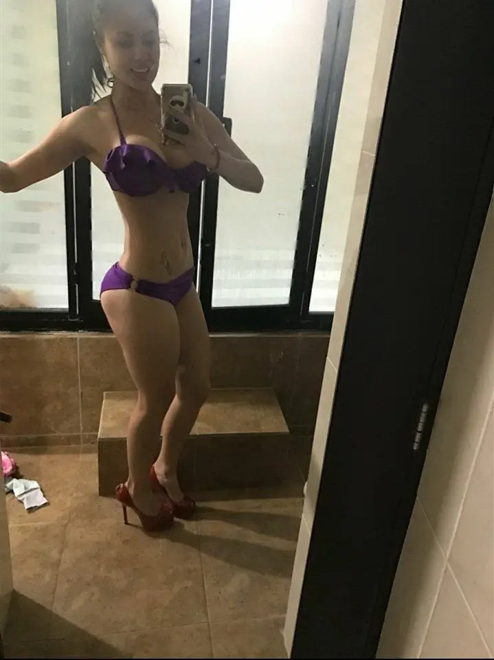 Sizzling Woman Flaunts Stunning Bikini Body: Explicit Beach Pose