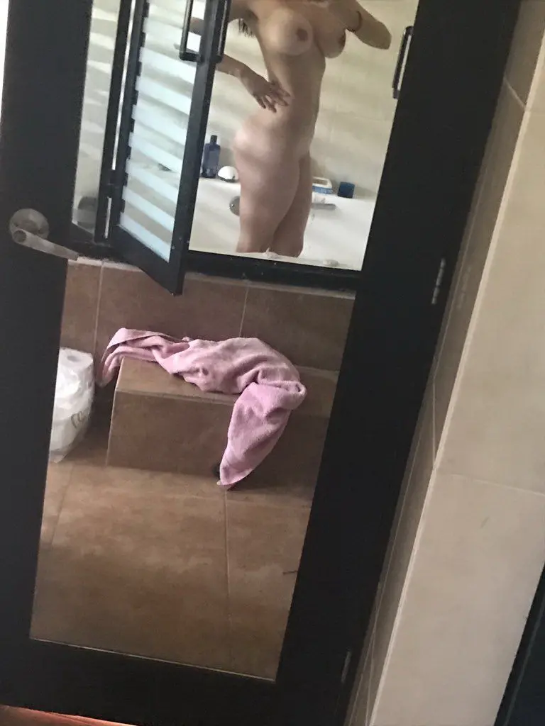 Sizzling Woman Flaunts Stunning Bikini Body: Explicit Beach Pose