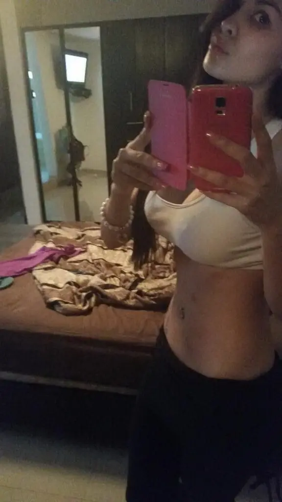 Sizzling Woman Flaunts Stunning Bikini Body: Explicit Beach Pose