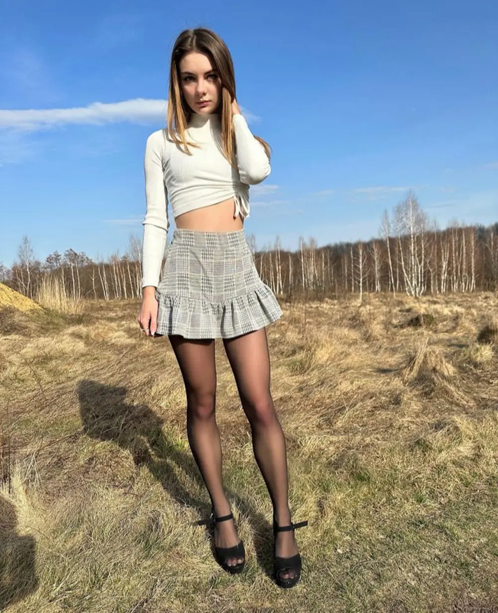 Sexy Babe Poses in Stockings and Tight Leggings, Showing Off Her Booty