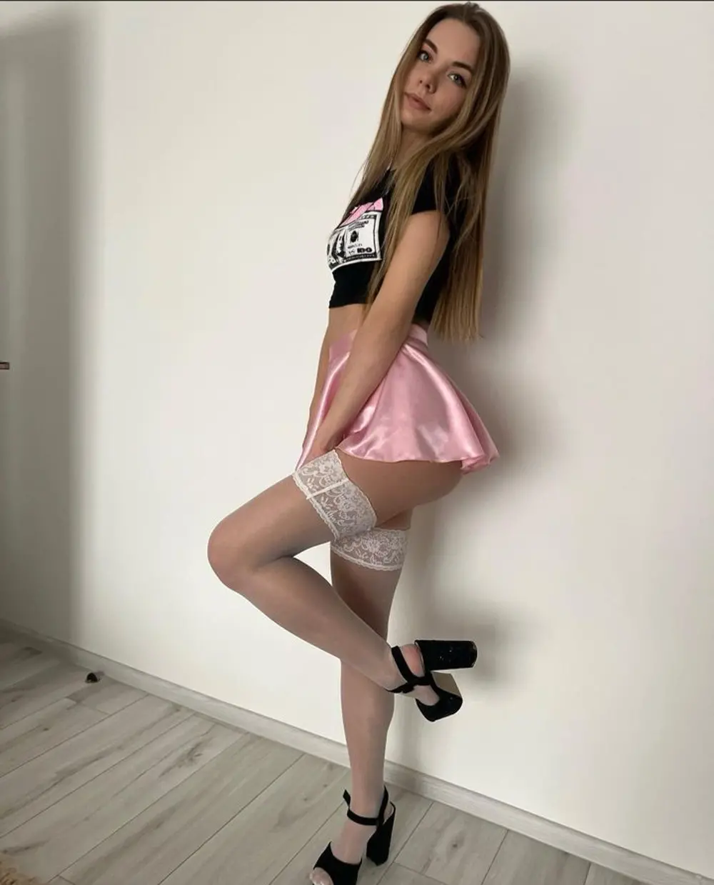 Sexy Babe Poses in Stockings and Tight Leggings, Showing Off Her Booty