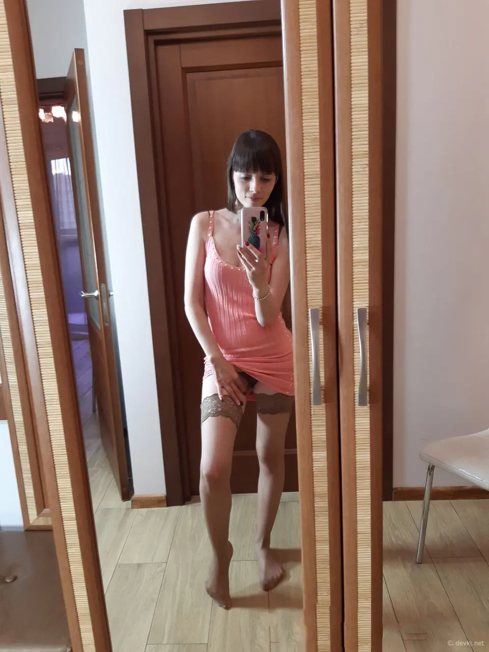 Seductive Brunette Poses in Stunning Stockings for Explicit Photoshoot