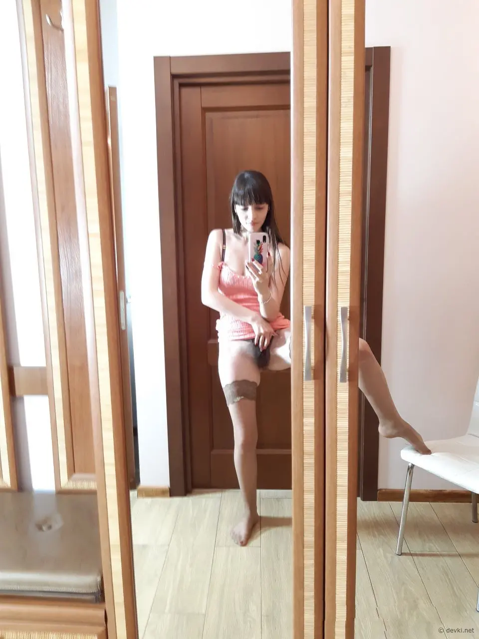 Seductive Brunette Poses in Stunning Stockings for Explicit Photoshoot