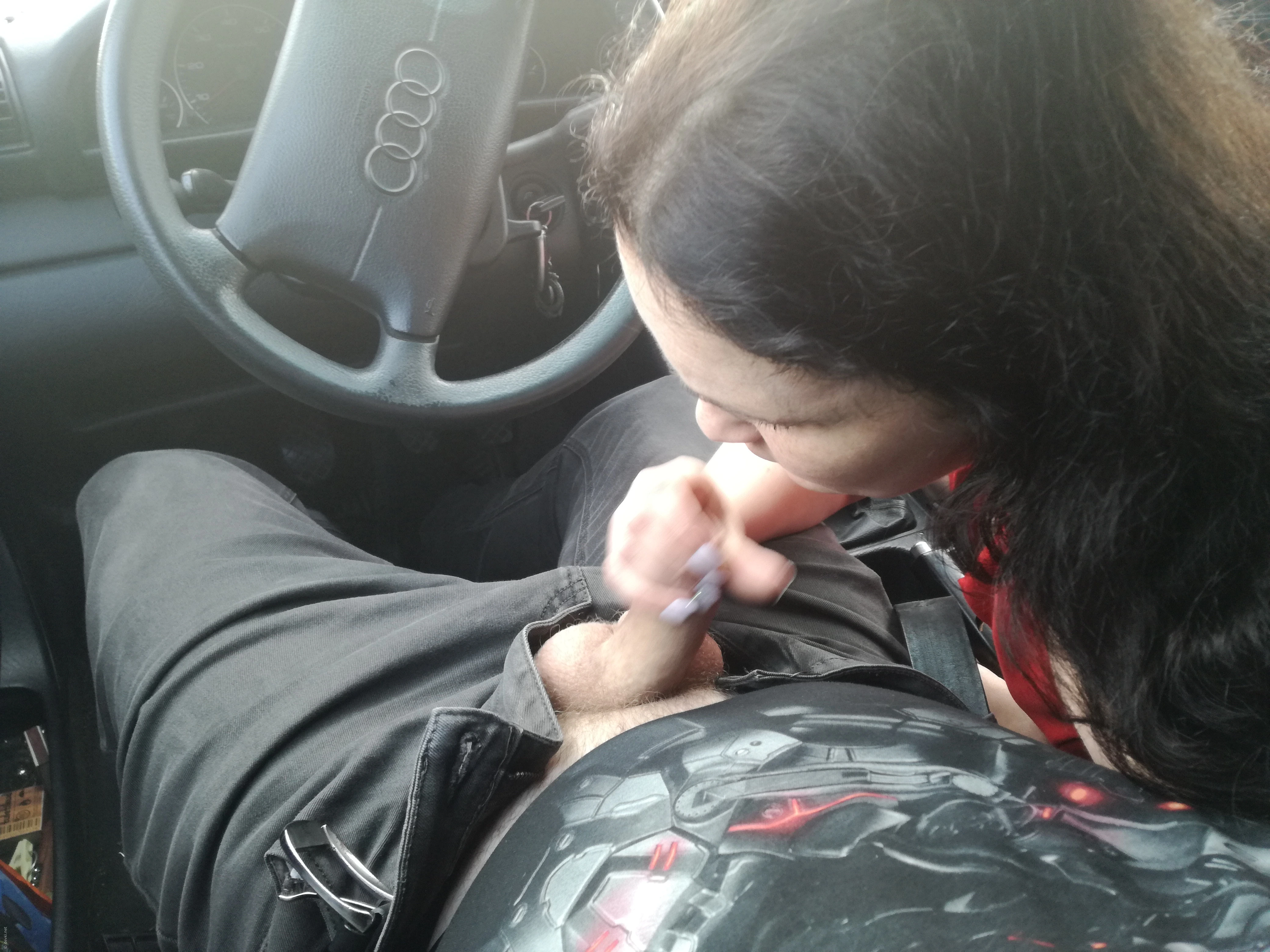 Woman Gives Blowjob in Car: Amateur Porn Photo