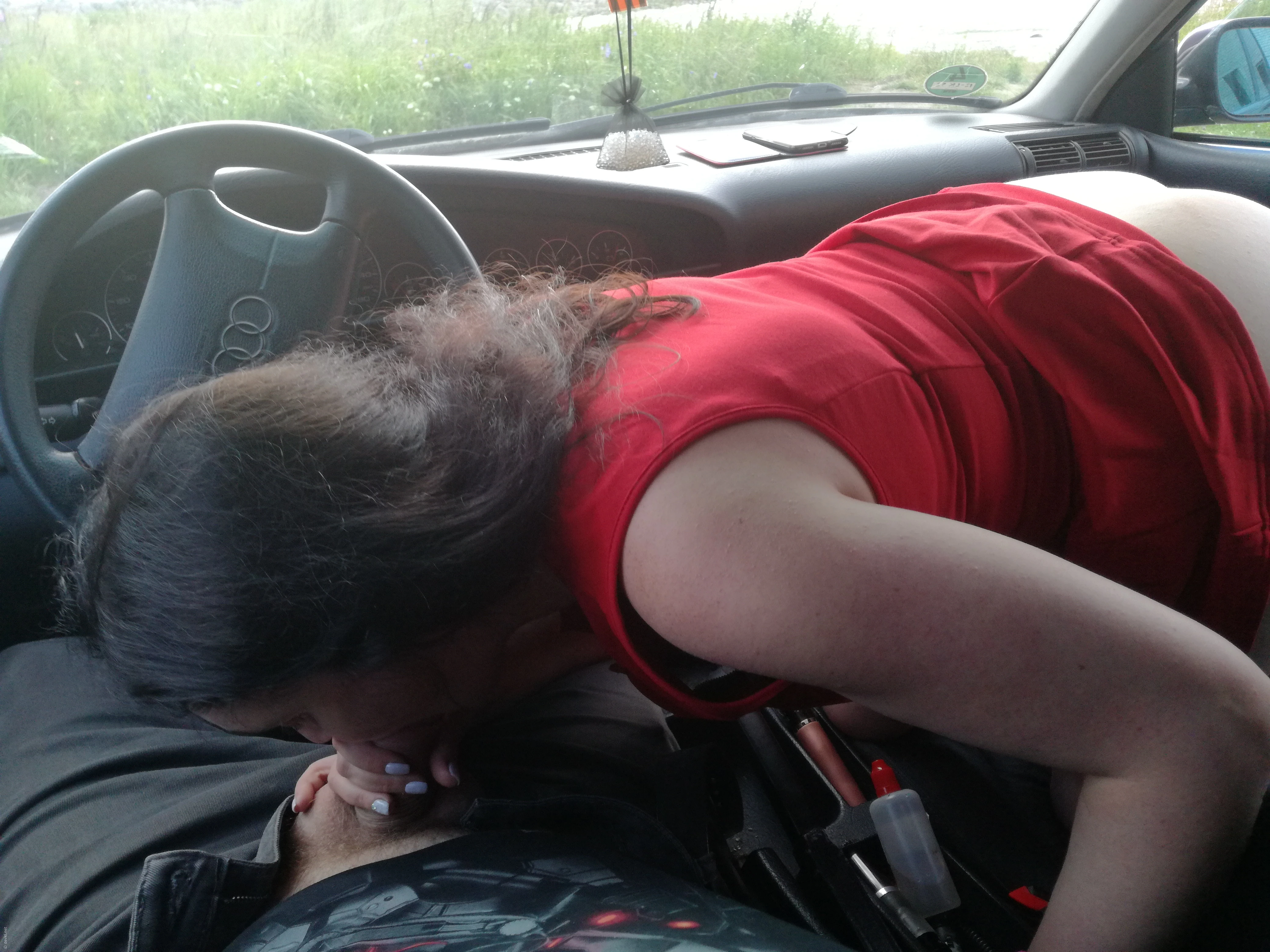 Woman Gives Blowjob in Car: Amateur Porn Photo