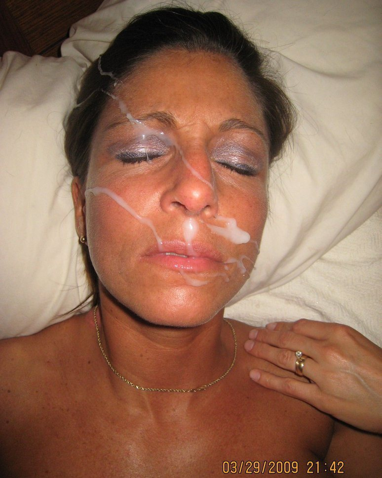 Amateur Husband Cums on Wife's Face - Explicit Facial Cumshot Photo